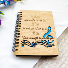 Load image into Gallery viewer, Laser cut and engraved wooden diary with musical quote and design