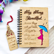 Load image into Gallery viewer, Laser cut and engraved wooden diary with Girl with an umbrella design and a beautiful quote
