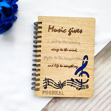 Load image into Gallery viewer, Laser cut and engraved wooden diary with musical quote and design