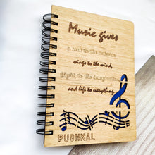Load image into Gallery viewer, Laser cut and engraved wooden diary with musical quote and design