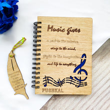 Load image into Gallery viewer, Laser cut and engraved wooden diary with musical quote and design